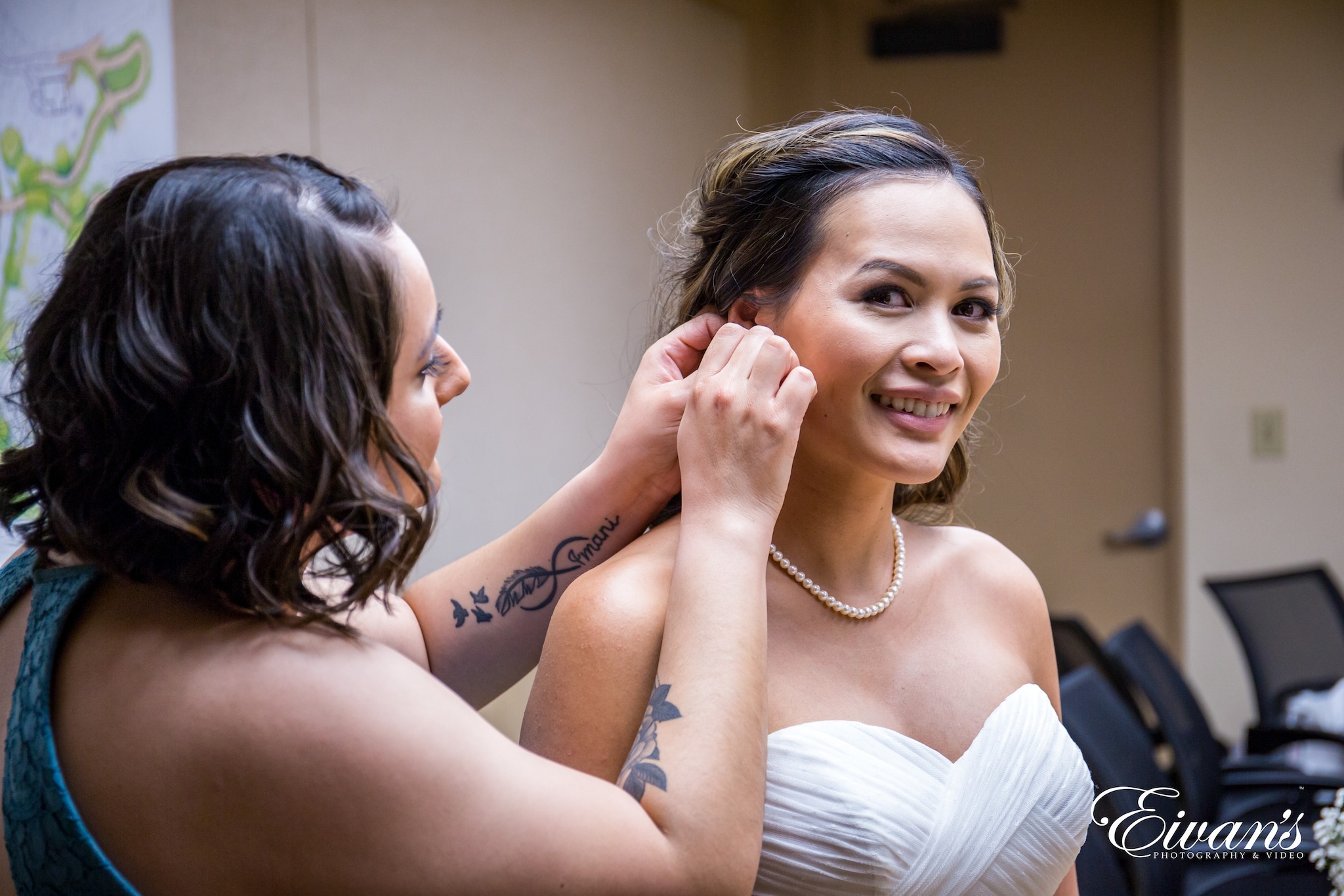 woman in white tube top smiling