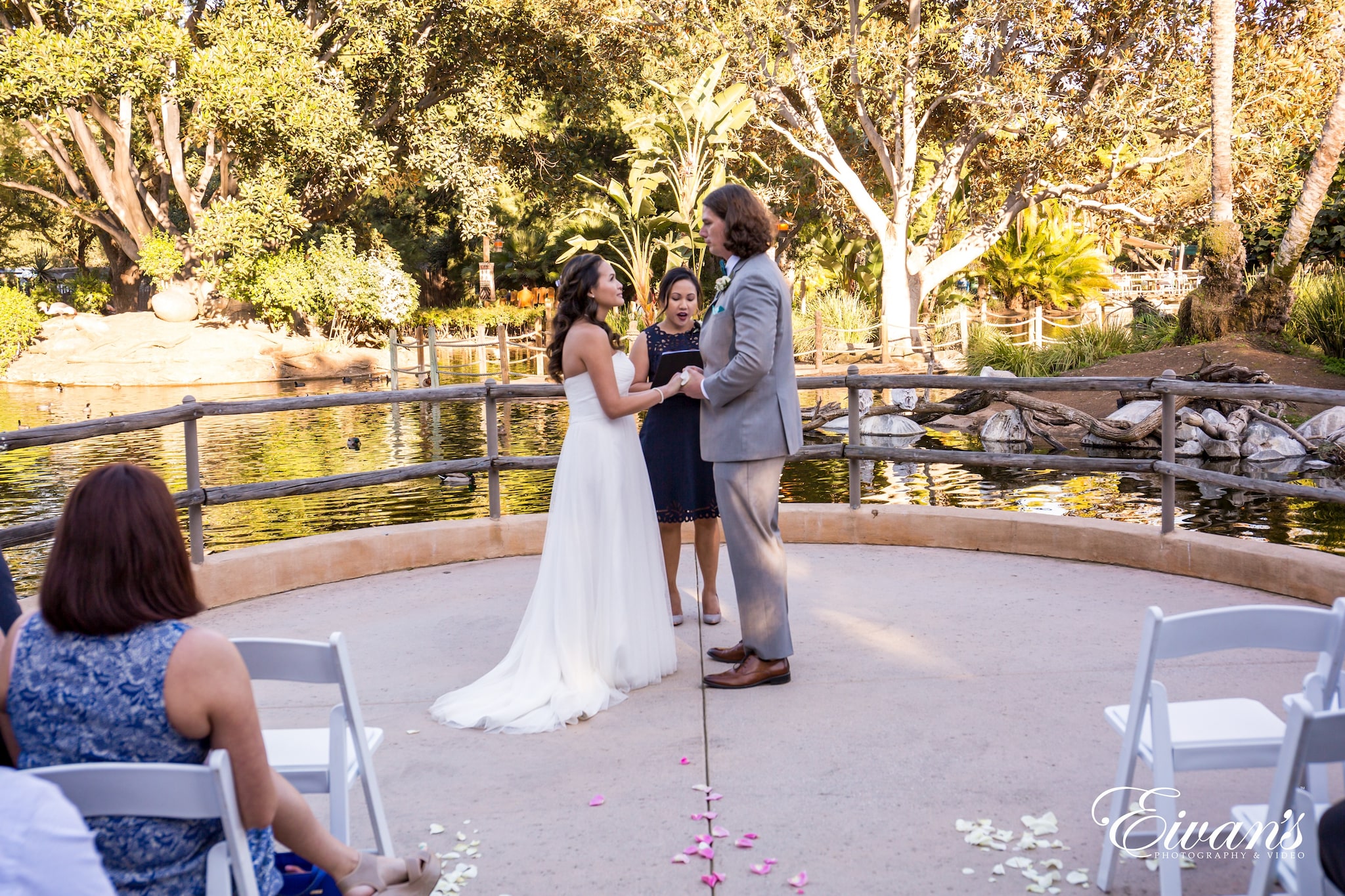 man and woman kissing on gray concrete pavement during daytime