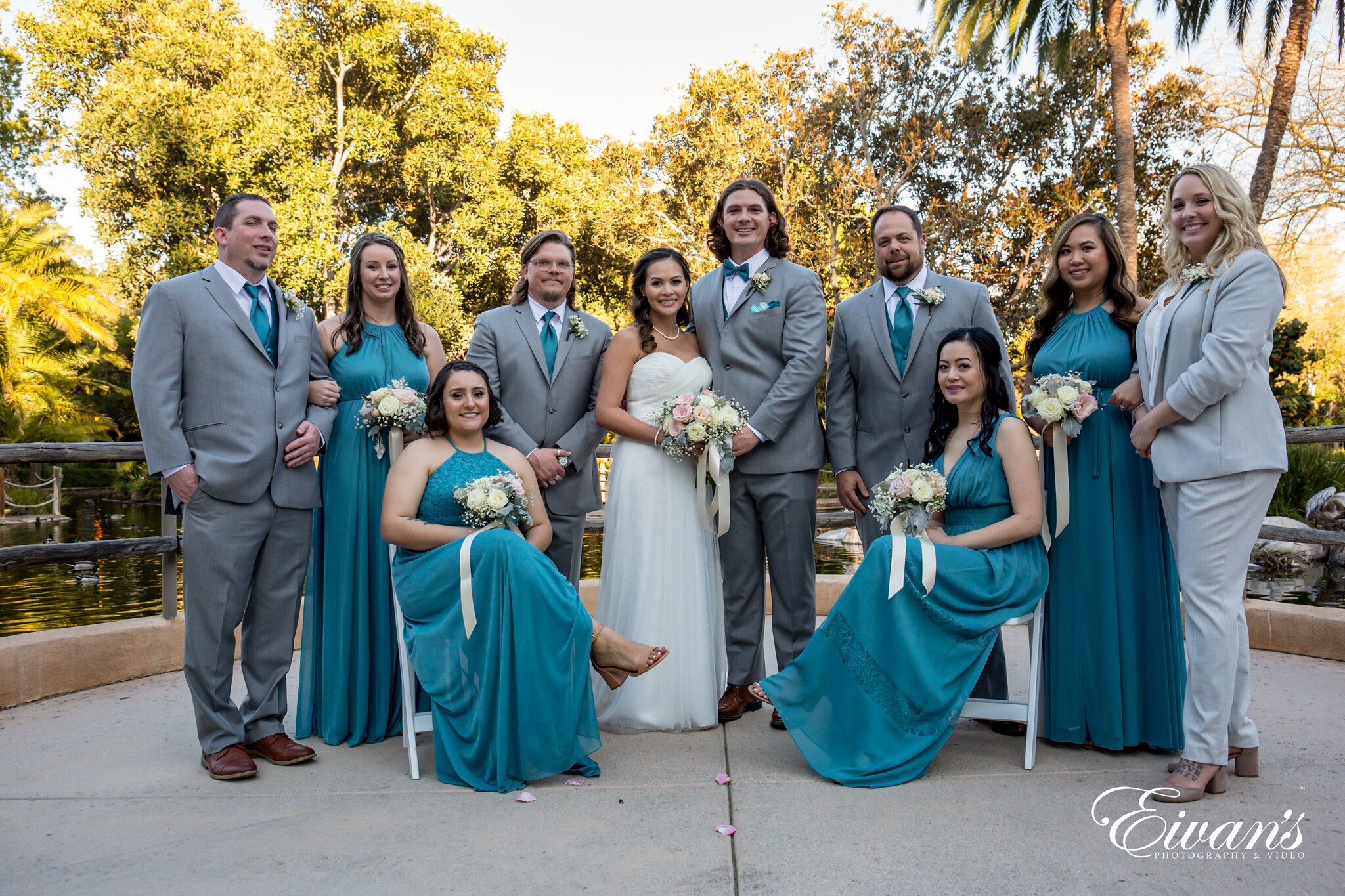 woman in green dress holding bouquet of flowers