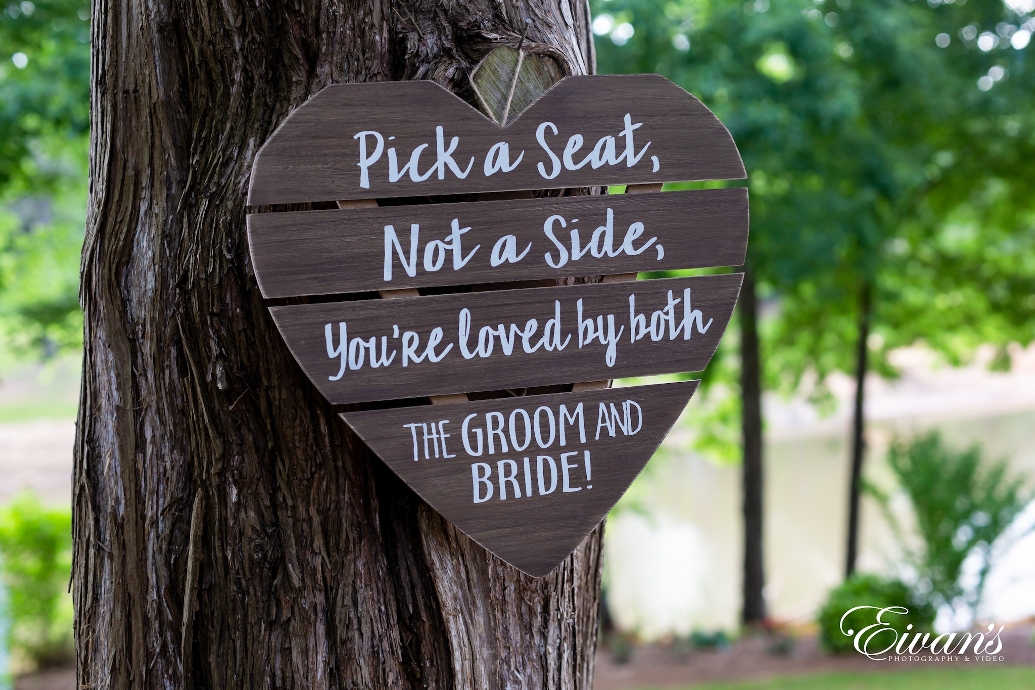 Pick A Seat Not A Side You're Loved by Groom And Bride Wooden Sign